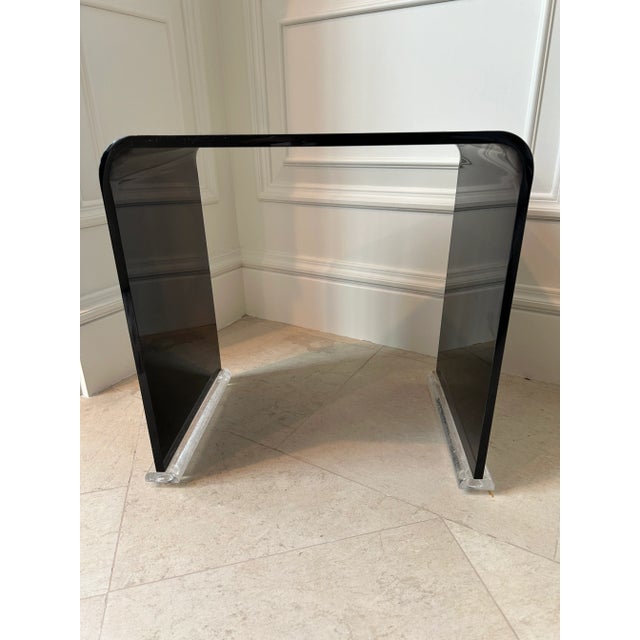 Fabulous 1980’s vintage black acrylic stool/ bench with clear acrylic plinth base, made in Italy. Great sleek postmodern...