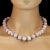 This stunning 20-inch Glowing Mauve Kunzite necklace is a graceful fusion of sophistication and charm. At its heart are...