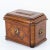 Baroque guild chest with side brass handles and domed lid. The body stands on pressed ball feet, has rounded corners and...