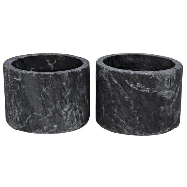 These simple yet sophisticated candleholders have been hand-carved from marble. Sized for use with traditional pillar...