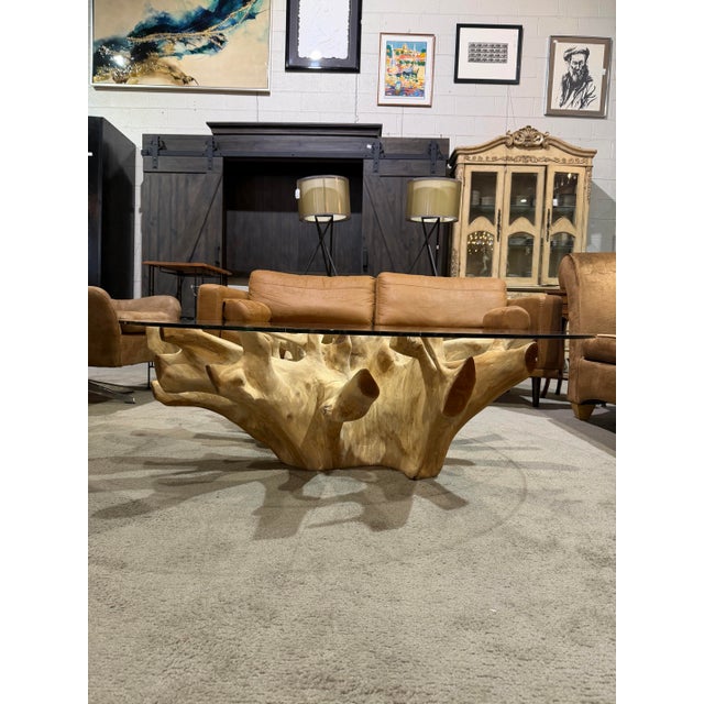 Striking “New Orleans” coffee table crafted from natural teak root and English elm, featuring an organic sculptural base...