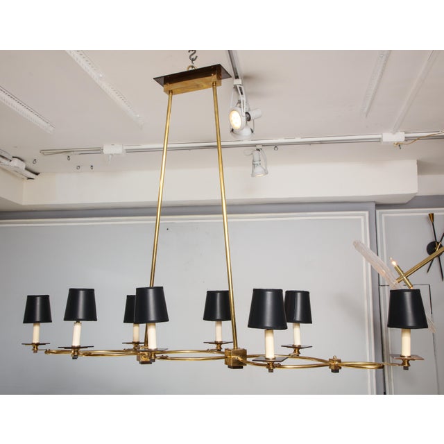 Bespoke Brass and bronze eight-arm fixture in the Mid Century manner. Please view our other listings for this piece in...