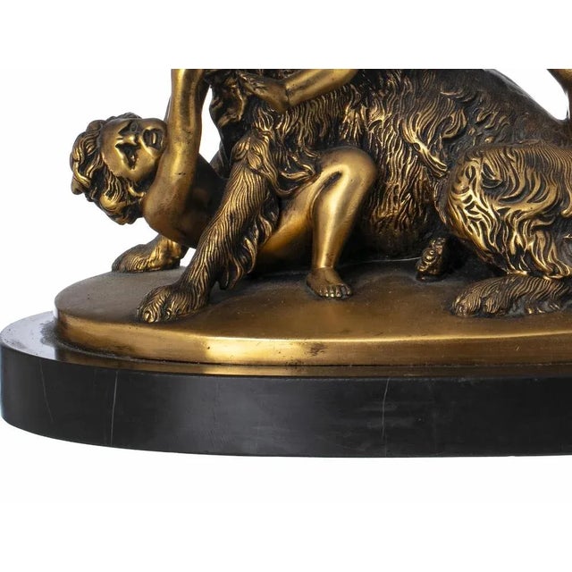 EDOUARD DROUOT (1859-1945) Sculptural group in gilded bronze, based on a black marble base. Signed. Dim.: 27 x 33 cm very...