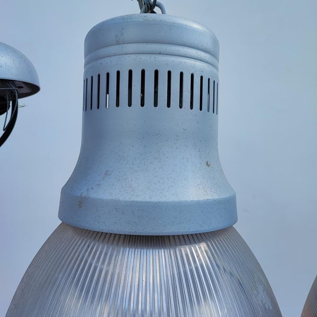 vintage industrial chandeliers 3 pieces Height: 90 Width: 25 This piece is attributed to the mentioned designer/maker. It...