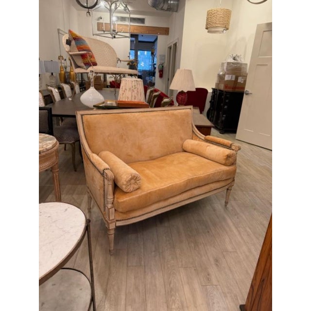 This is a gorgeous Louis XVI settee in the softest fur like fabric in a butter color with verdigris nailheads and a cream...