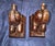 These vintage hand-carved hardwood elephant bookends feature a charming seated posture on rectangular wooden bases and are...