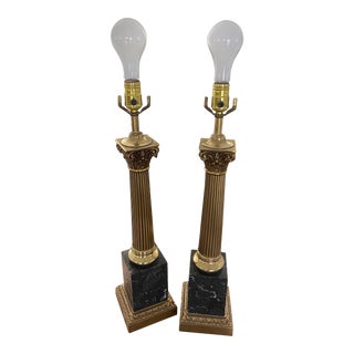 Early 20th Century Black Marble and Carved Brass Neoclassical Column Lamps, a Pair For Sale