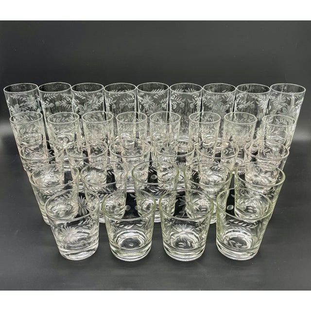 An incredibly rare find for the mid-century mixologist. This massive 32 piece set of vintage barware by the Federal Glass...