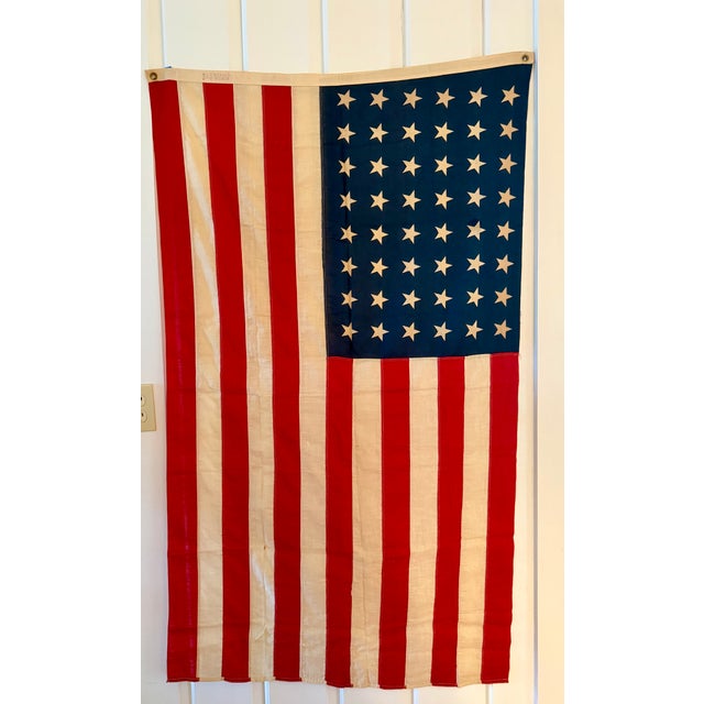 Authentic 48-star cotton flag from the 1920s-1930s. Great aged patina, sewn stripes, displays well. Measures approximately...
