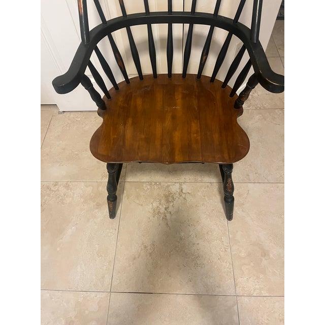 This is a vintage Colonial-style Windsor chair, by Homestead House and their Touchstone Collection line. It is a spindle-...
