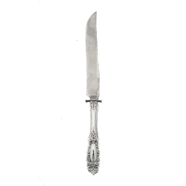 We are happy to offer you this sterling silver carving fork and knife in the Grand Duchess pattern by Towle Silversmiths....