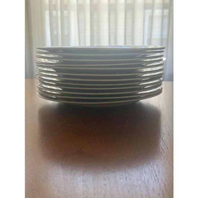 A complete 12-place-setting collection of the coveted Le Houx (“The Holly”) pattern by Gien France. This classic faïence...