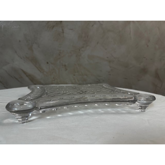 An elegant cut crystal trivet attributed to Baccarat, dating from the Art Nouveau period, early 20th century. This...