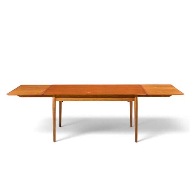 Arne Vodder for Sibast Mid Century Danish Teak Expanding Dining Table with 2 Leaves This table measures: 59.75 wide x...