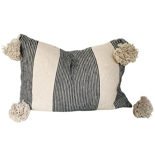Moroccan handloomed cotton pom-pom lumbar pillow with zipper closure. New duck feather-and-down fill inserts. Pattern on...