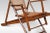 Walnut framed folding Steamer deck chair. The cane work back and seat, flanked by scrolling arms and splayed legs. It...
