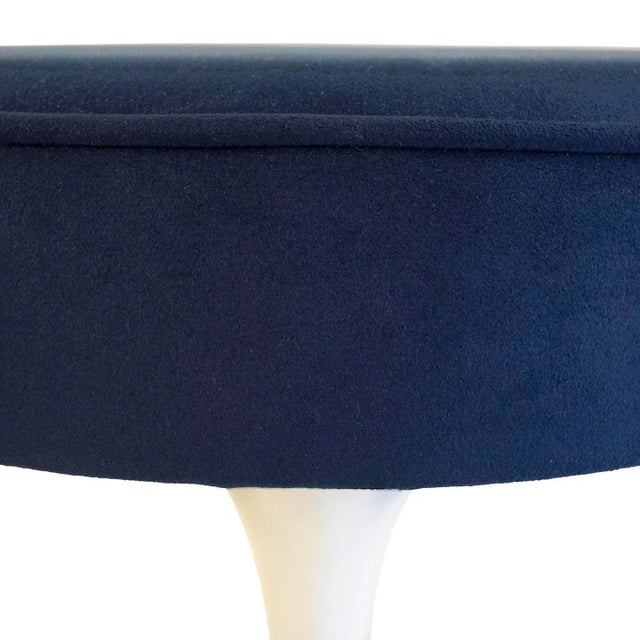 Eero Saarinen designed the "Tulip" stool in 1957. Made out of cast aluminum and reupholstered in blue ultra-suede. The...