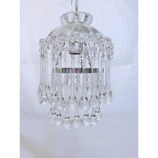 Dome layered chandelier with cut glass dish, octagon chain and 30% leaded crystal teardrops. It rewired and it has 1...