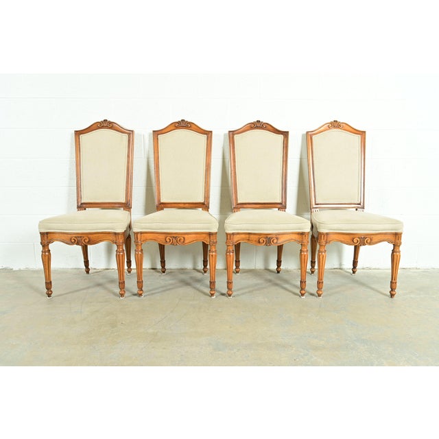 A gorgeous set of four French Regency Louis XVI style dining chairs In the manner of Baker Furniture USA, Circa Late 20th...