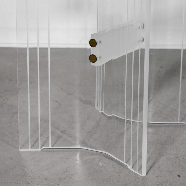 Fantastic set of lucite tables consisting of one coffee table and two side tables that look amazing combined into one...