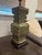 Elegant vintage Asian-inspired ceramic table lamp featuring a celadon crackle glaze with raised relief detailing. The...