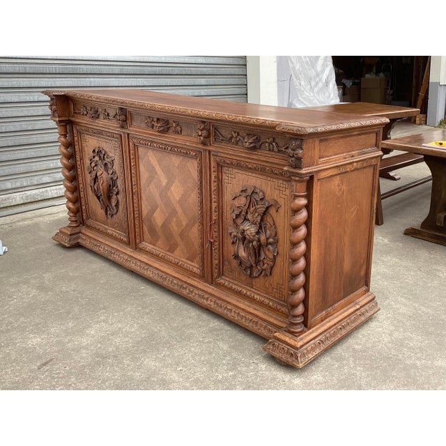 Very handsome French credenza/sideboard. This piece features 2 barley-twist columns and 2 carved doors for storage. A...
