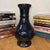 "About This Piece About This Piece This vase commands attention with its deep, inky black glaze that gleams like polished...