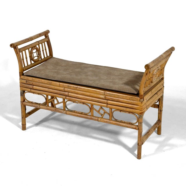 This lovely Chinoiserie style bench constructed of bamboo with a woven cane seat and a loose upholstered seat cushion has...