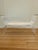 Lucite Bench with 5 slat sides & base. Newly upholstered seat. Gold toned metal sides & stretcher at the base.