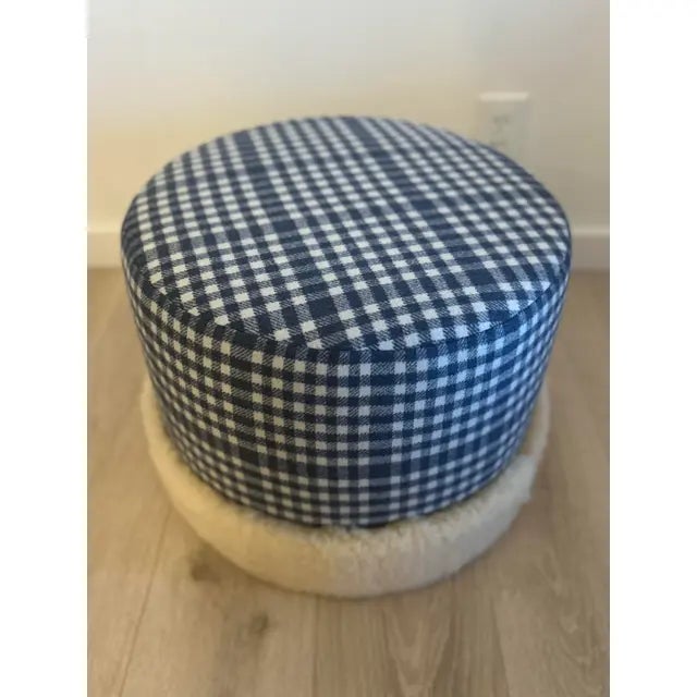 Custom ottoman upholstered in Scottish Flannel & banded in sheepskin