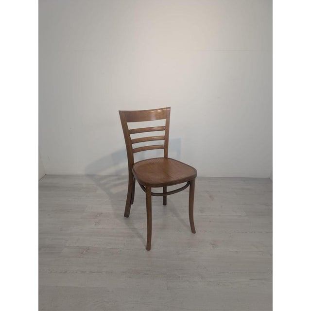 Paged AMP 8000 Beech Chair This classic bentwood chair from the Paged A-8000 line comes from Poland, and its design and...