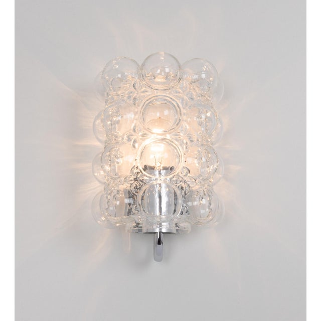 Wonderful large pair of chrome wall lights, from limburg glashütte, germany, circa 1960-1970. Clear bubble glasses on a...