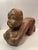 This hand-carved wooden sculpture is often referred to as a "Baby Buddha" or a "Lucky Thai Baby Buddha," and sometimes as...