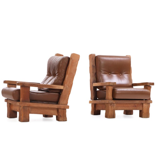 Boldly sculpted with strong geometric lines, these lounge chairs exemplify the post-war Brutalist aesthetic. Crafted in...