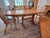 Vintage Hunt Country Furniture "Hancock" trestle base extension dining table crafted in Oak in the Light Honey finish. Set...