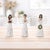 Bring contemporary elegance to your holiday décor with this Modern Angel Figurines with Gold Metal Wings (Set of 6)....