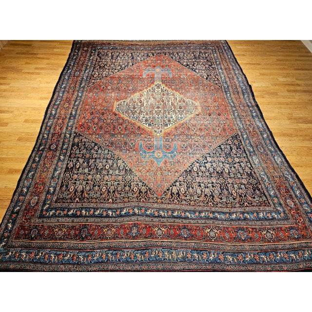 "A striking and rare find, this oversized 19th century Persian Bidjar rug is a testament to the enduring craftsmanship of...