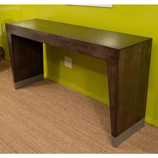 Sleek and chic, this tiger maple console is perfect for an entry or behind a sofa. The exotic look of the tiger maple and...