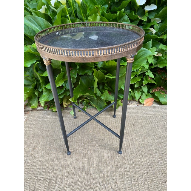 Vintage French Influenced Round marble top Lamp Tables with Brass Galleries These vintage round lamp tables feature a...