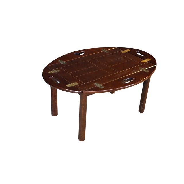 This classic 1991 Bombay Company butler's tray table features a rich, polished cherry finished wood, resting on four...