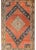 A mesmerizing early 20th century Central Asian Samarkand rug with a large central diamond medallion with a stylized floral...