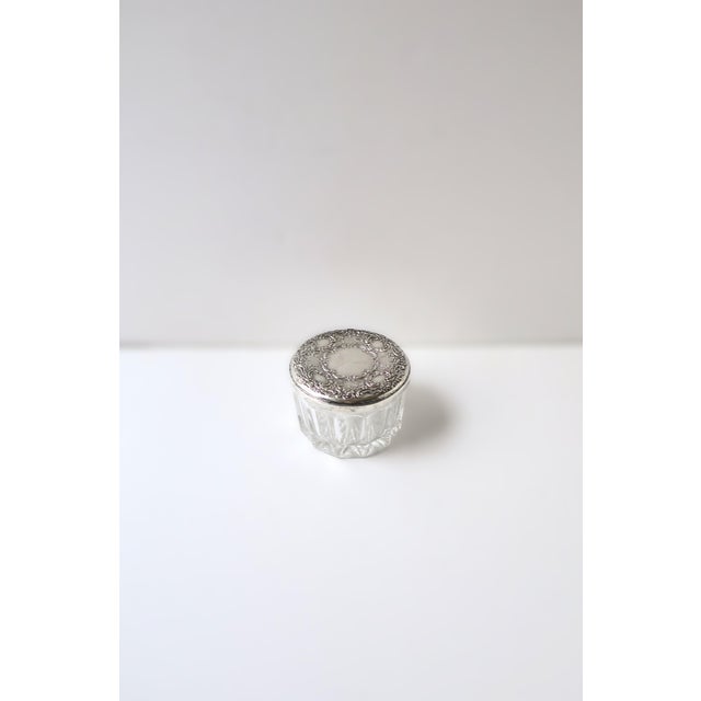 A sterling silver and cut-glass jewelry box with vanity mirror, circa late-20th century, USA. A round cut-glass jewelry...