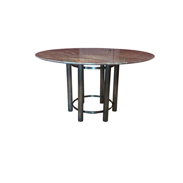 Circular occassional or dining table with aged brass legs and polished marble top. Table top dimensions are: Diameter: 51"...