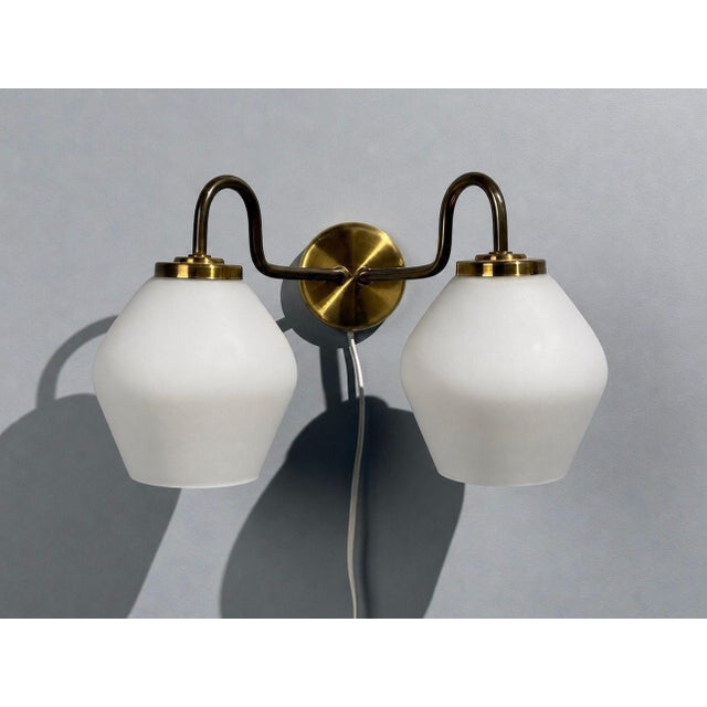 Swedish Mid-Century Modern, Double Wall Light or Sconce, Brass, Glass, Sweden, 1980s A modernist double wall light in the...