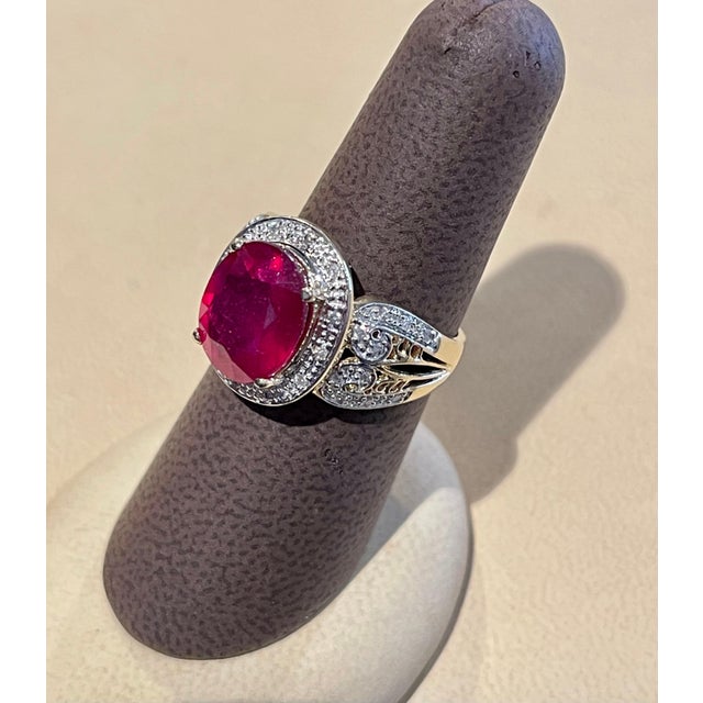 Oval 7.5 Carat Treated Ruby and 1 Carat Diamond 14 Karat Yellow Gold Ring For Sale - Image 11 of 18