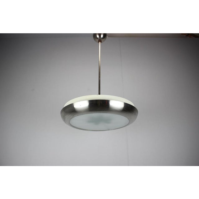 Art Deco UFO pendant chandelier designed by Josef Hůrka for Napako, manufactured in Czechoslovakia in the 1930s. Suspended...