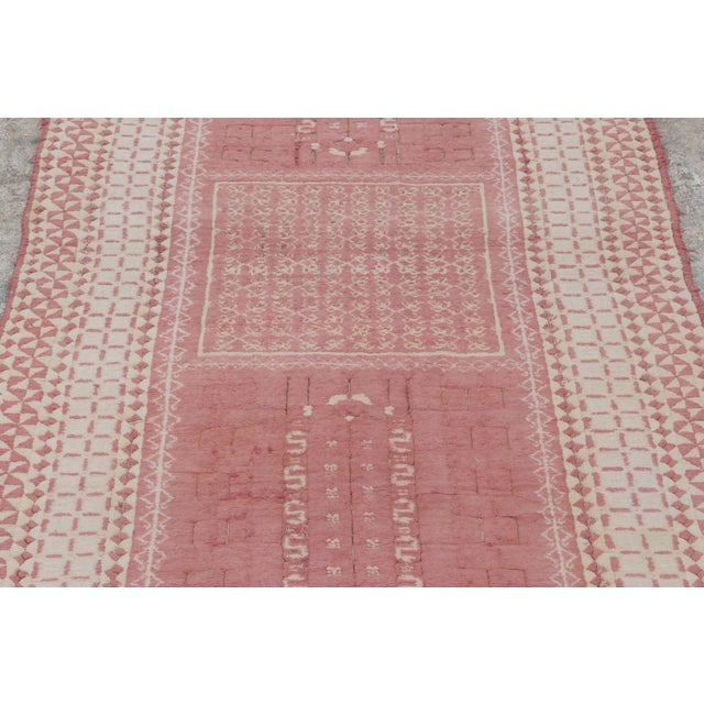 Handwoven in a blend of wool and cotton, this 4x6 antique Agra rug from circa 1920-1930 is a rare and character-rich...