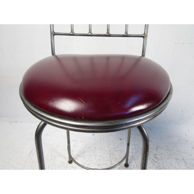 This charming bar stools features soft leather seats and a rugged iron frame. With a simplistic design, these stool will...