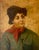 A charming 19th century oil on canvas portrait depicting a young boy with a cigarette resting between his lips. Dressed in...