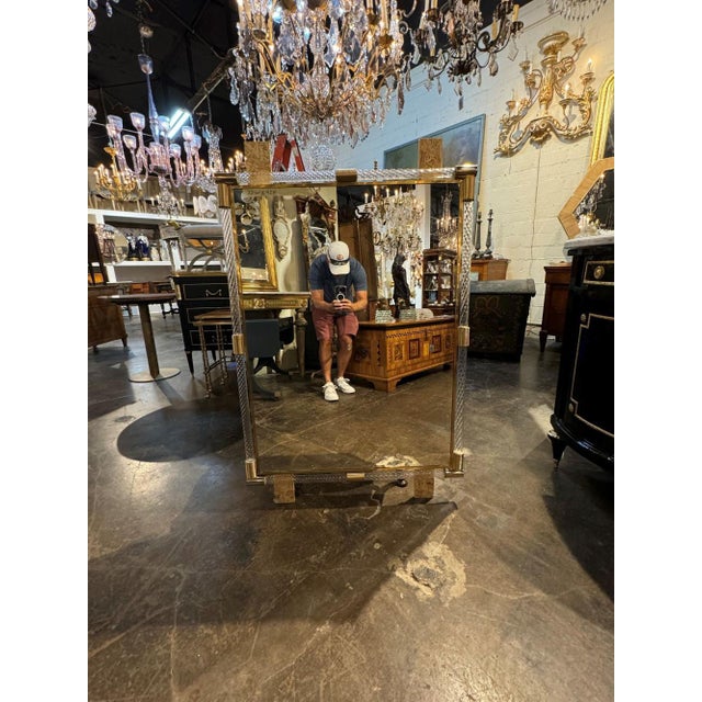 Beautiful Murano twist glass and brass mirror. A perfect addition for a lovely home that works in a variety of decors....